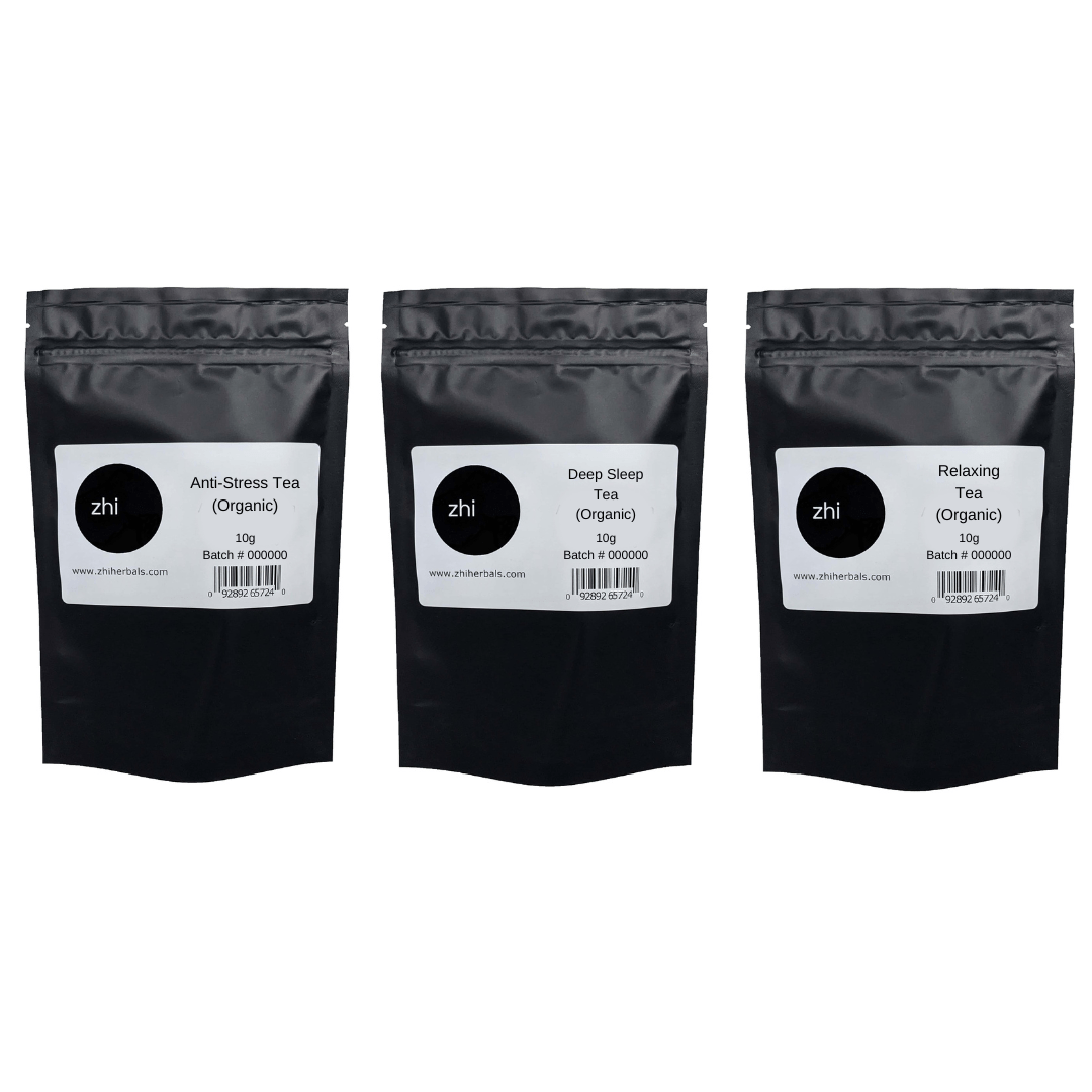 A row of three Zhi Herbals teas in 10g black resealable bags with product labels and barcodes.