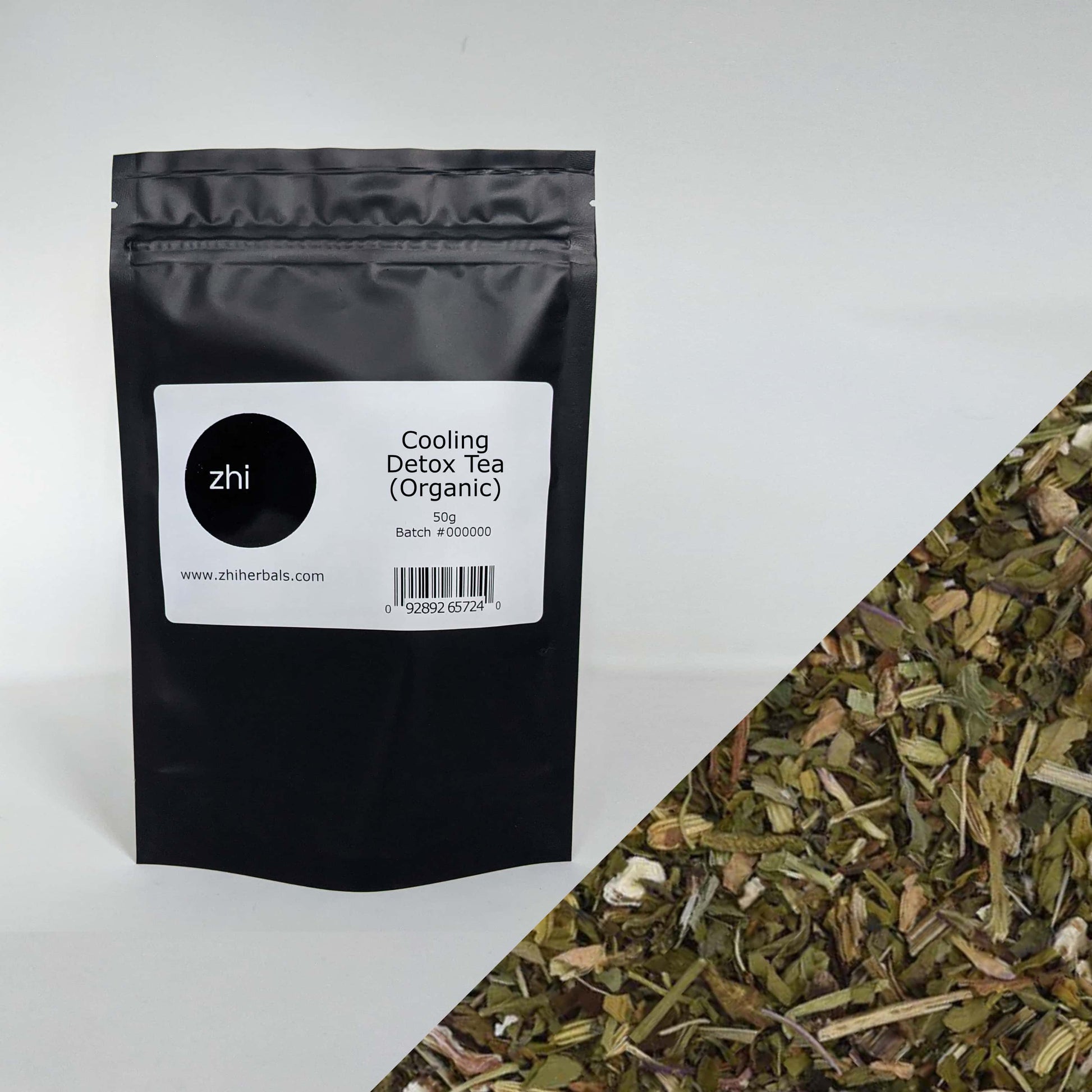 Zhi Herbals Organic Cooling Detox Tea, 50g black package with label, next to a close-up of the green herb blend.