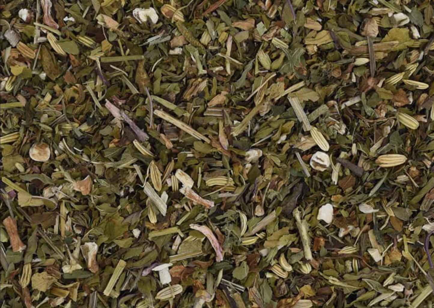 Close-up texture of Cooling Detox Tea, showing green leaves used for teas and herbal remedies.