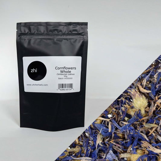 Zhi Herbals Organic Cornflowers Whole, 50g black package with label, next to a close-up of the vibrant blue flowers.