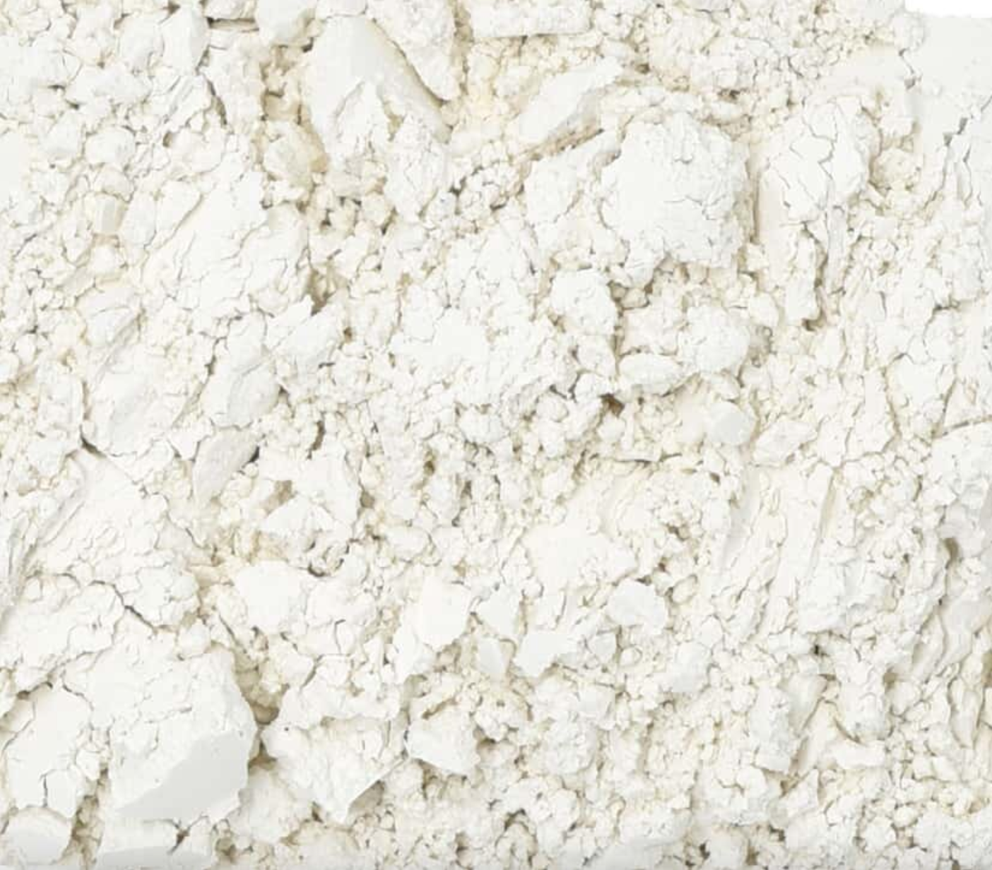 Close-up texture of dried diatomaceous earth, showing fine white powder used for herbal remedies.