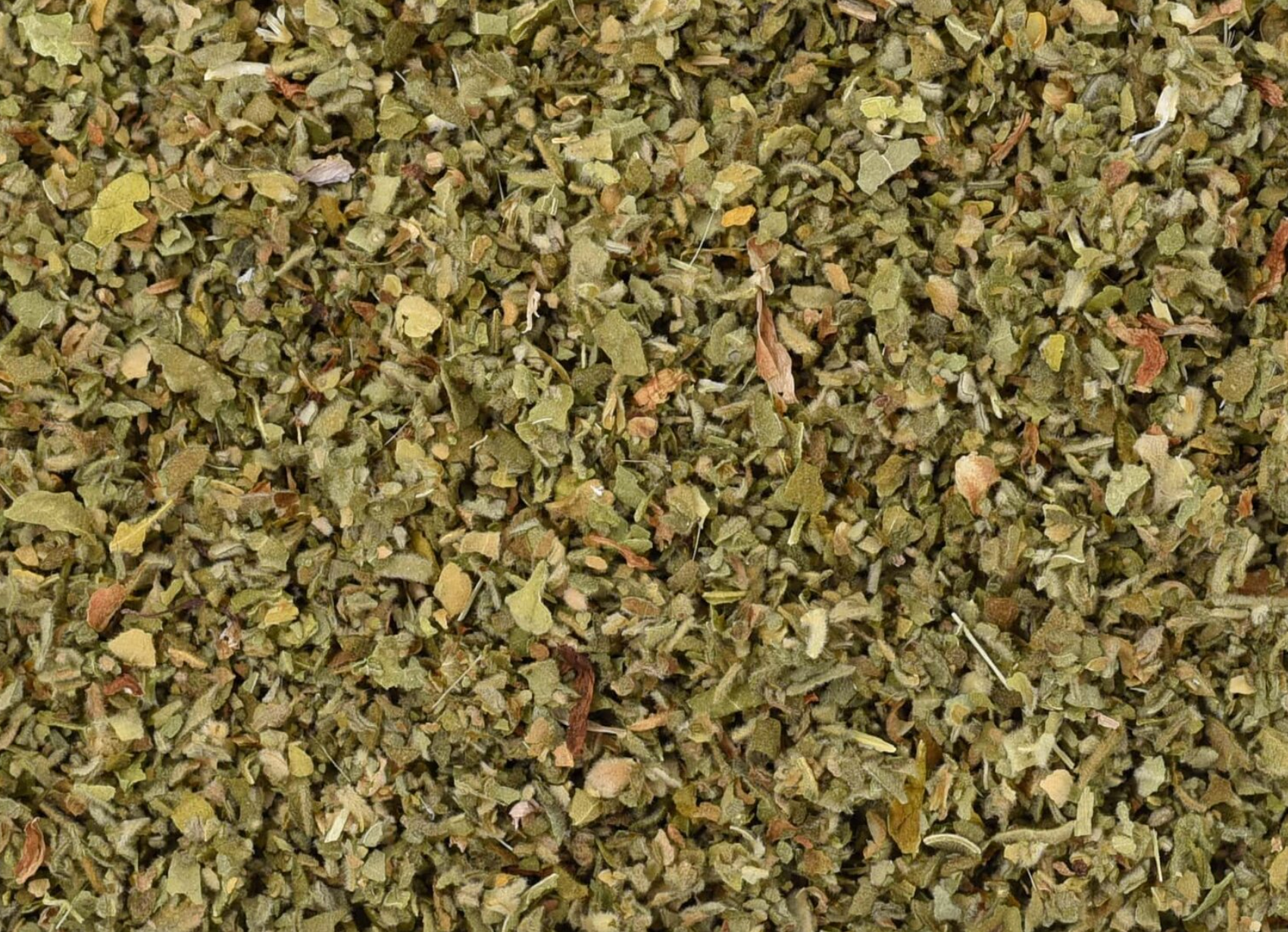 Close-up of dried marshmallow leaf, showing chopped green leaves used for teas and herbal remedies.