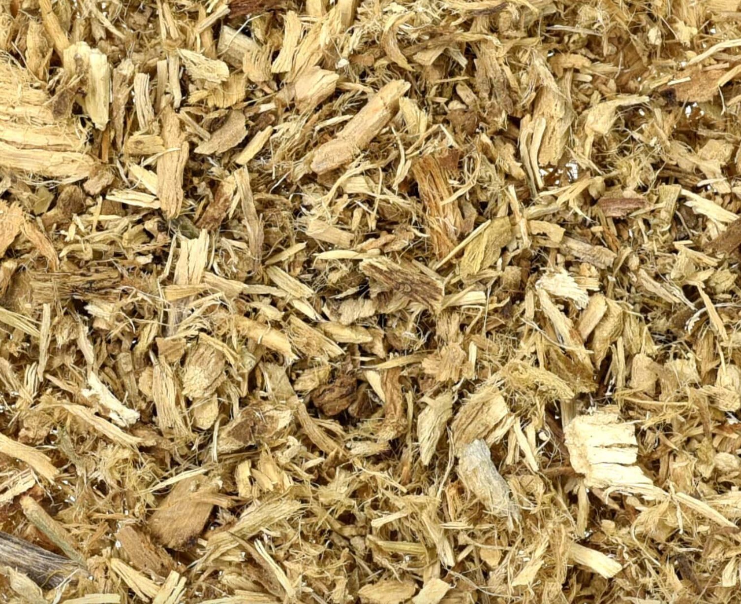 Close-up of dried marshmallow root, showing chopped off-white root pieces used for teas and herbal remedies.