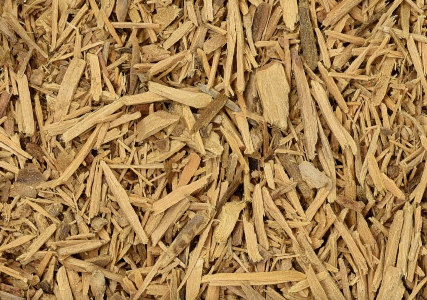 Close-up of dried muira puama, showing finely cut brown bark used for teas and herbal remedies.