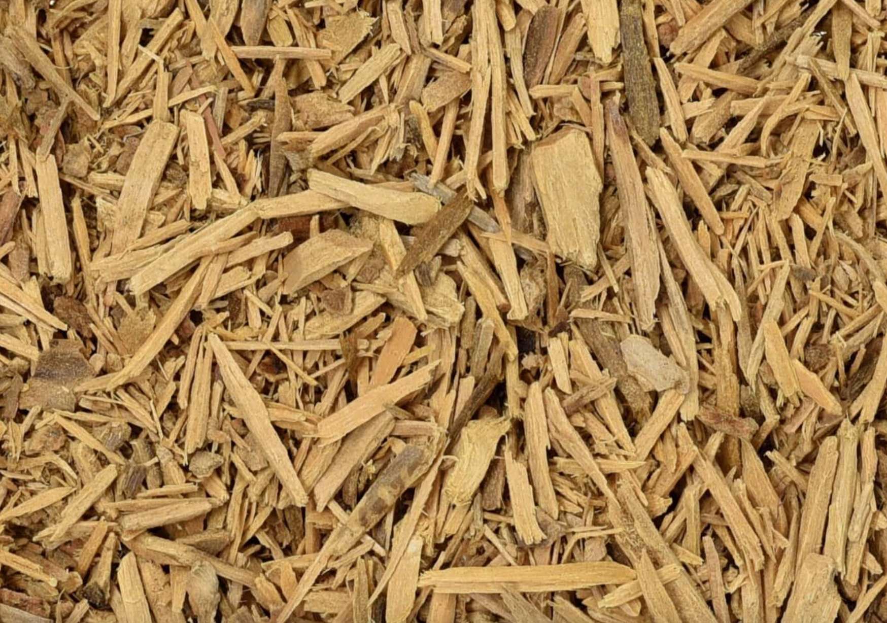 Close-up of dried muira puama, showing finely cut brown bark used for teas and herbal remedies.