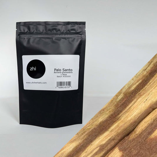 Zhi Herbals Palo Santo, 50g black package with label, next to a close-up of the brown wood texture.