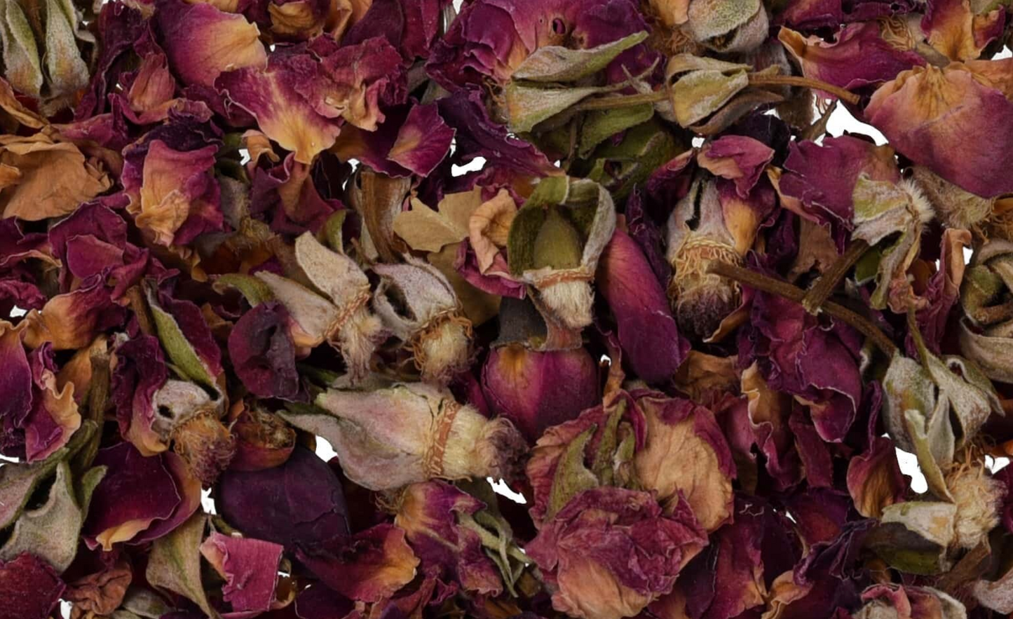 Close-up of dried rose buds, showing chopped petals, buds, and pieces used for teas and herbal remedies.